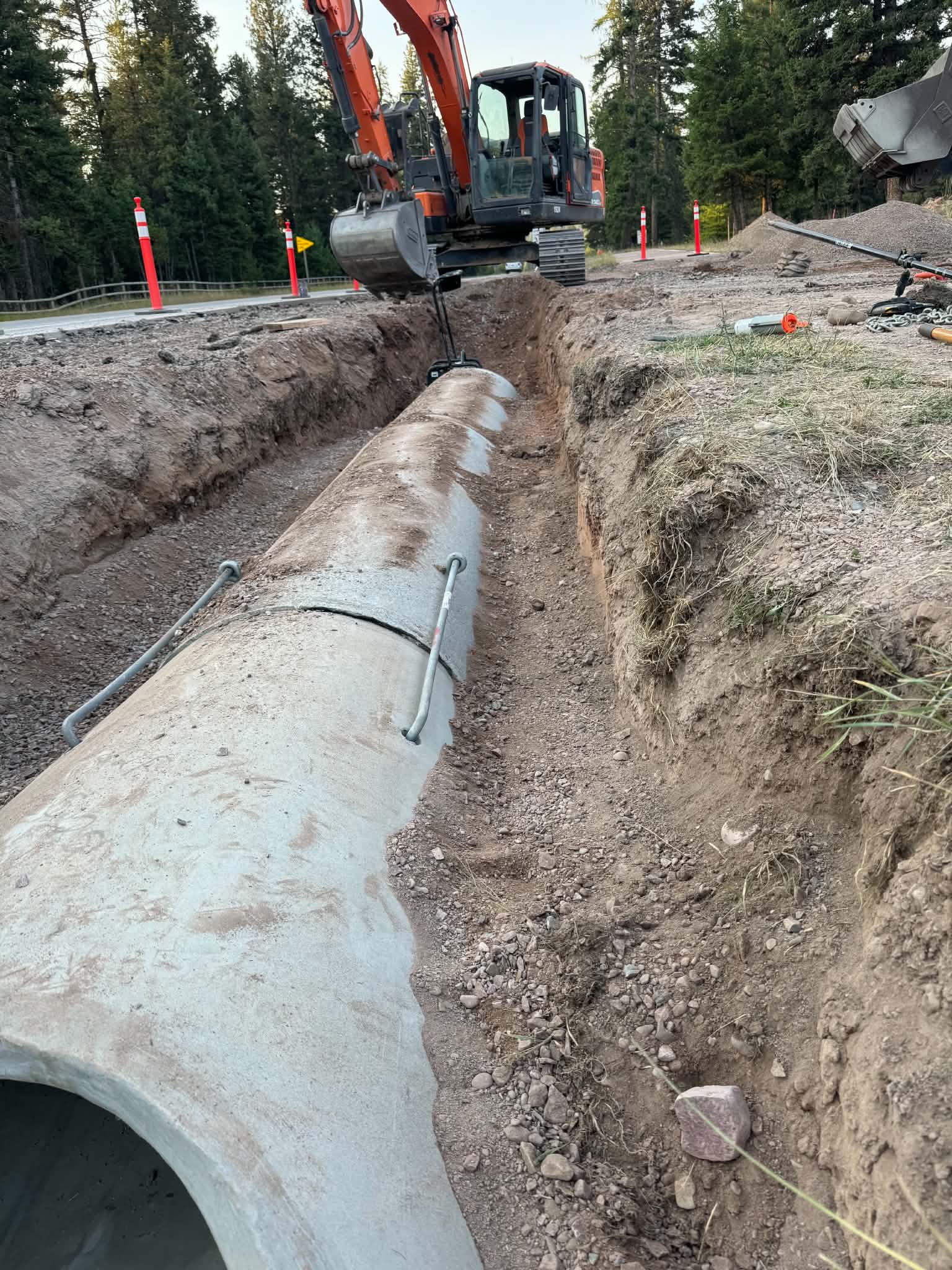 Utility trenching with excavator